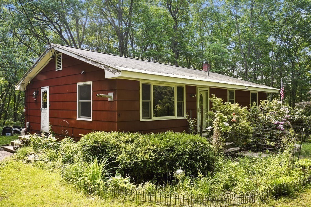 9 Number 6 Road Leverett, MA 01054 - Photo 20 of 26 a view of a house with a flower garden