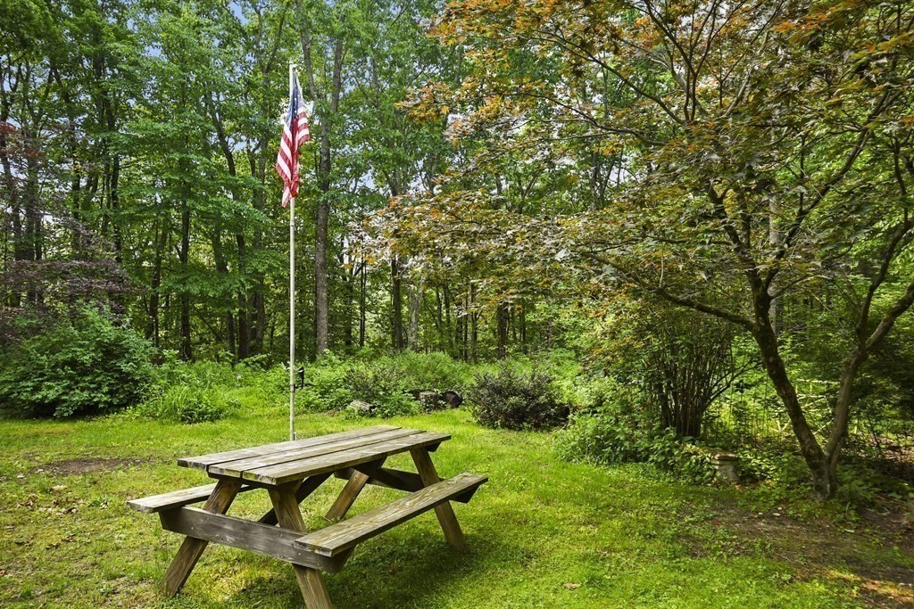 9 Number 6 Road Leverett, MA 01054 - Photo 21 of 26 a backyard of a house with table and chairs