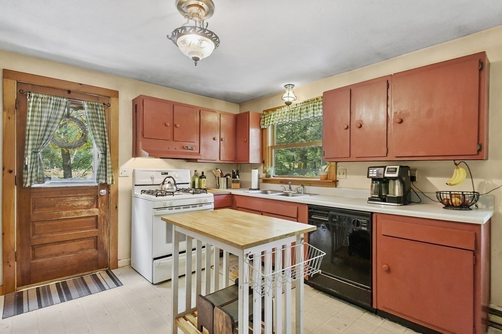 9 Number 6 Road Leverett, MA 01054 - Photo 3 of 26 a kitchen with a stove a sink dishwasher and a refrigerator with wooden floor