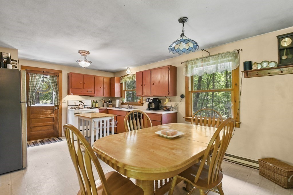 9 Number 6 Road Leverett, MA 01054 - Photo 5 of 26 a view of a dining room with furniture window and outside view