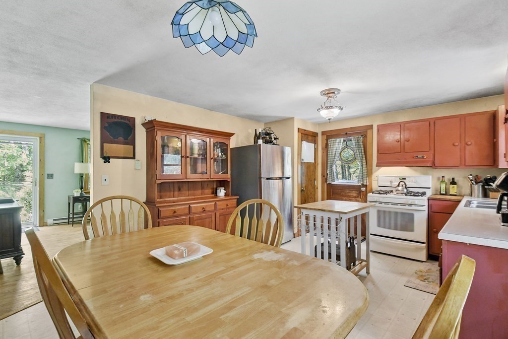 9 Number 6 Road Leverett, MA 01054 - Photo 6 of 26 a dining room with furniture a window and kitchen view