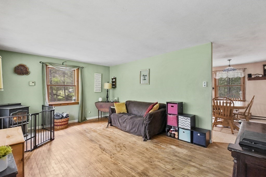 9 Number 6 Road Leverett, MA 01054 - Photo 8 of 26 a living room with furniture a flat screen tv and a window