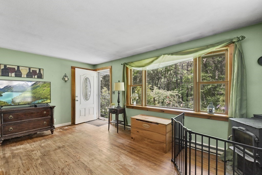 9 Number 6 Road Leverett, MA 01054 - Photo 10 of 26 a view of a room with furniture wooden floor and windows
