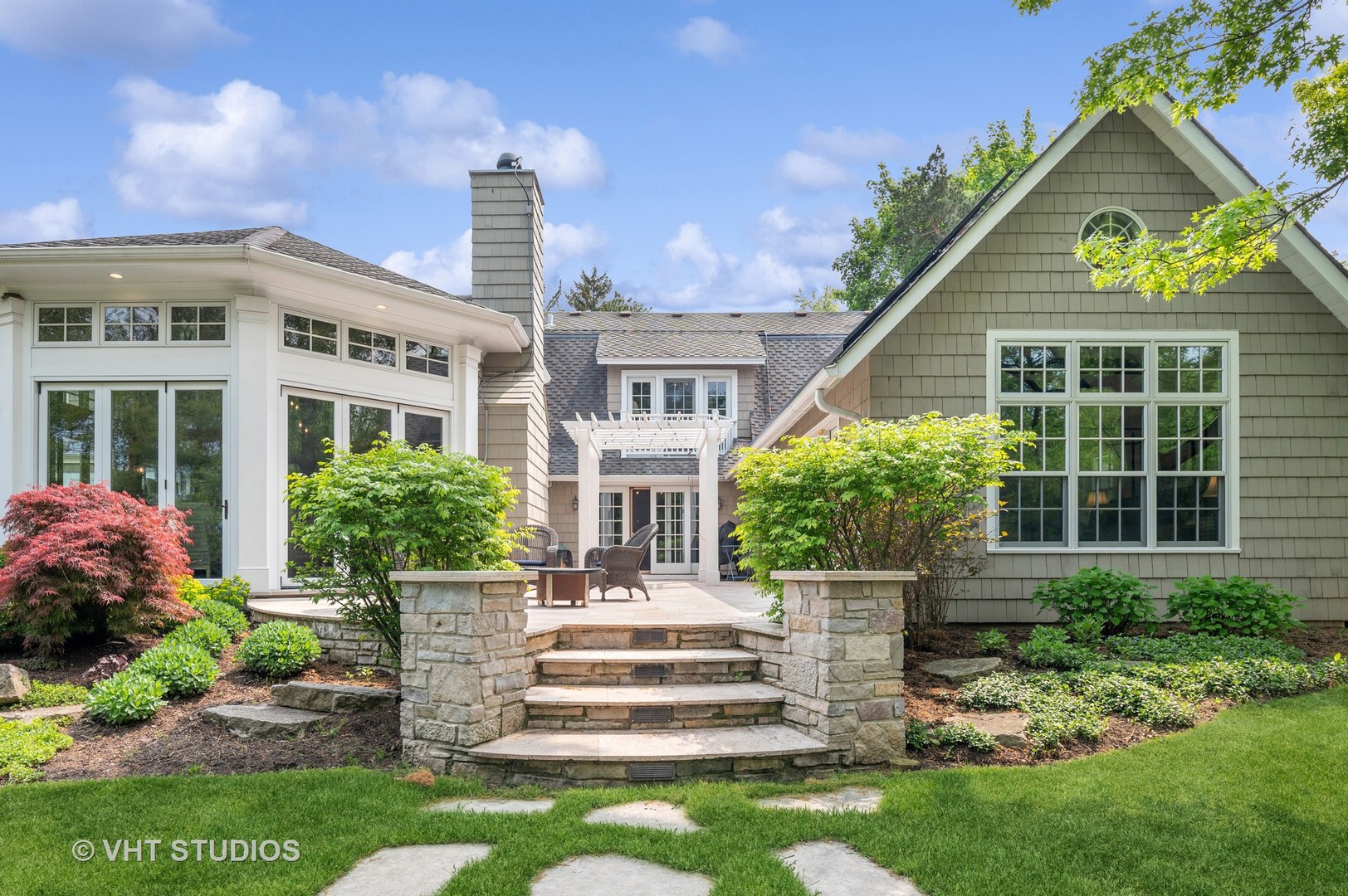 730 Glenview Road Glenview, IL 60025 - Photo 8 of 45 a front view of a house with a garden and plants
