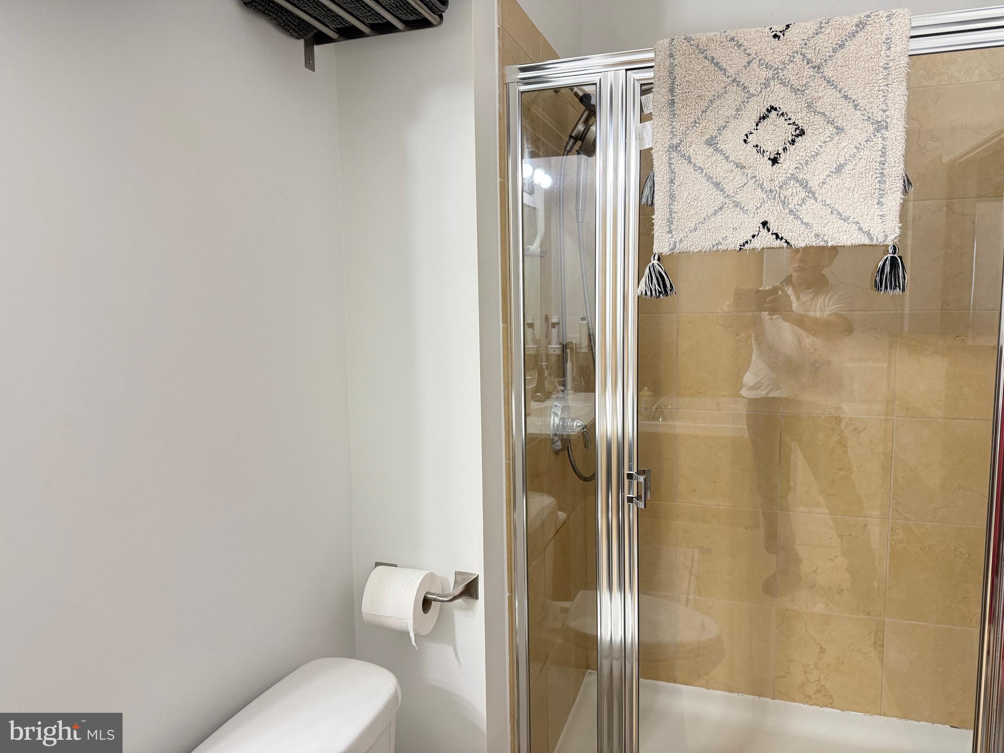901 North Penn Street, Unit R2101 Philadelphia, PA 19123 - Photo 29 of 33 a bathroom with a toilet and a shower