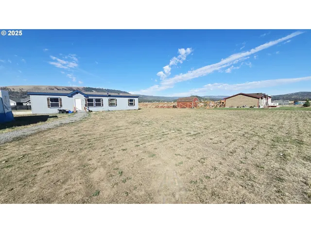 a black and white photo of a house