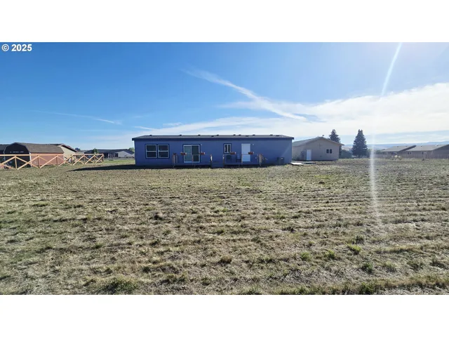 a bathroom with a sink and a large window