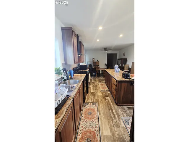 a living room with furniture and a dresser