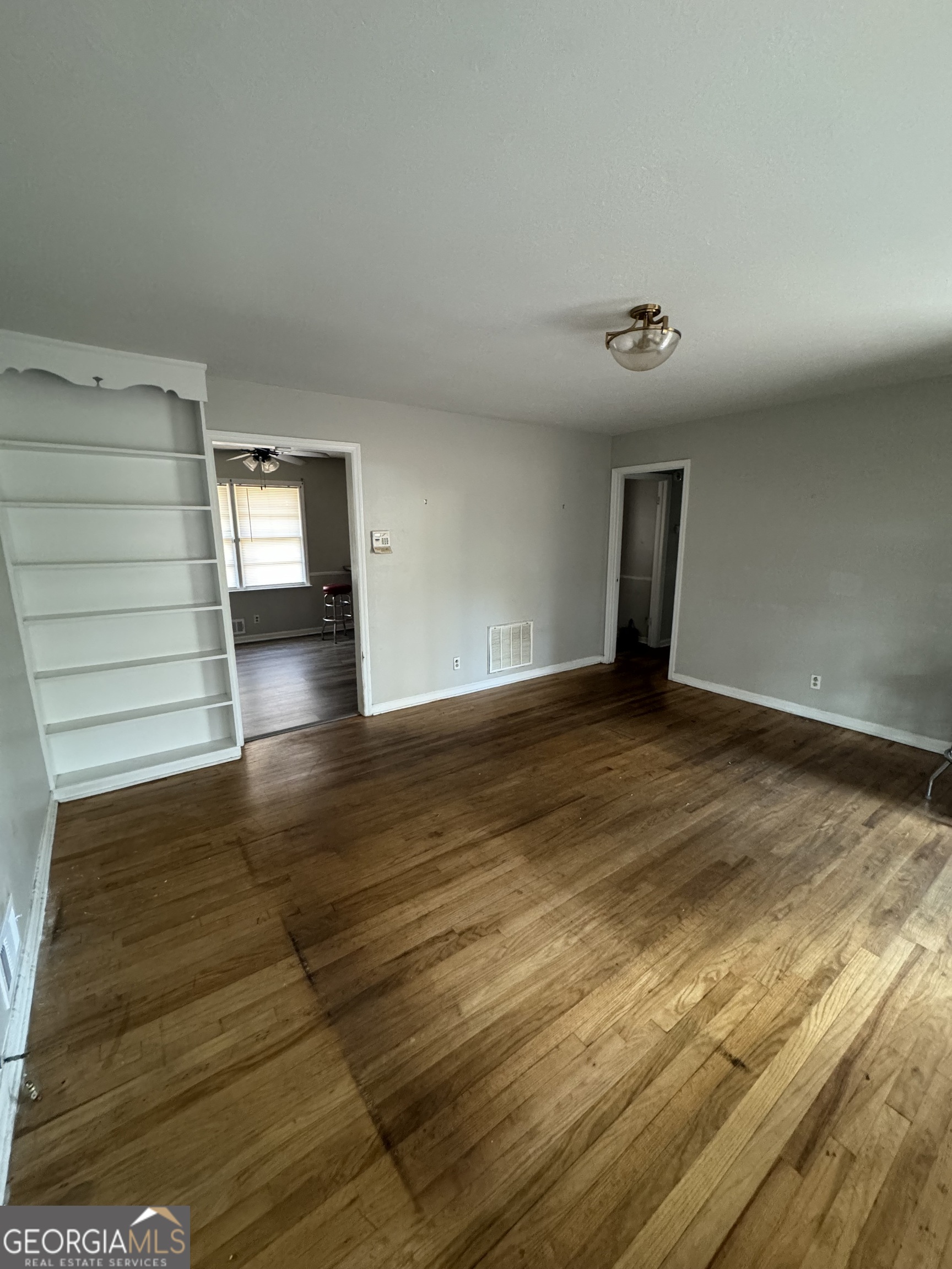 4367 Pharr Avenue Macon, GA 31210 - Photo 3 of 12 a view of an empty room and wooden floor