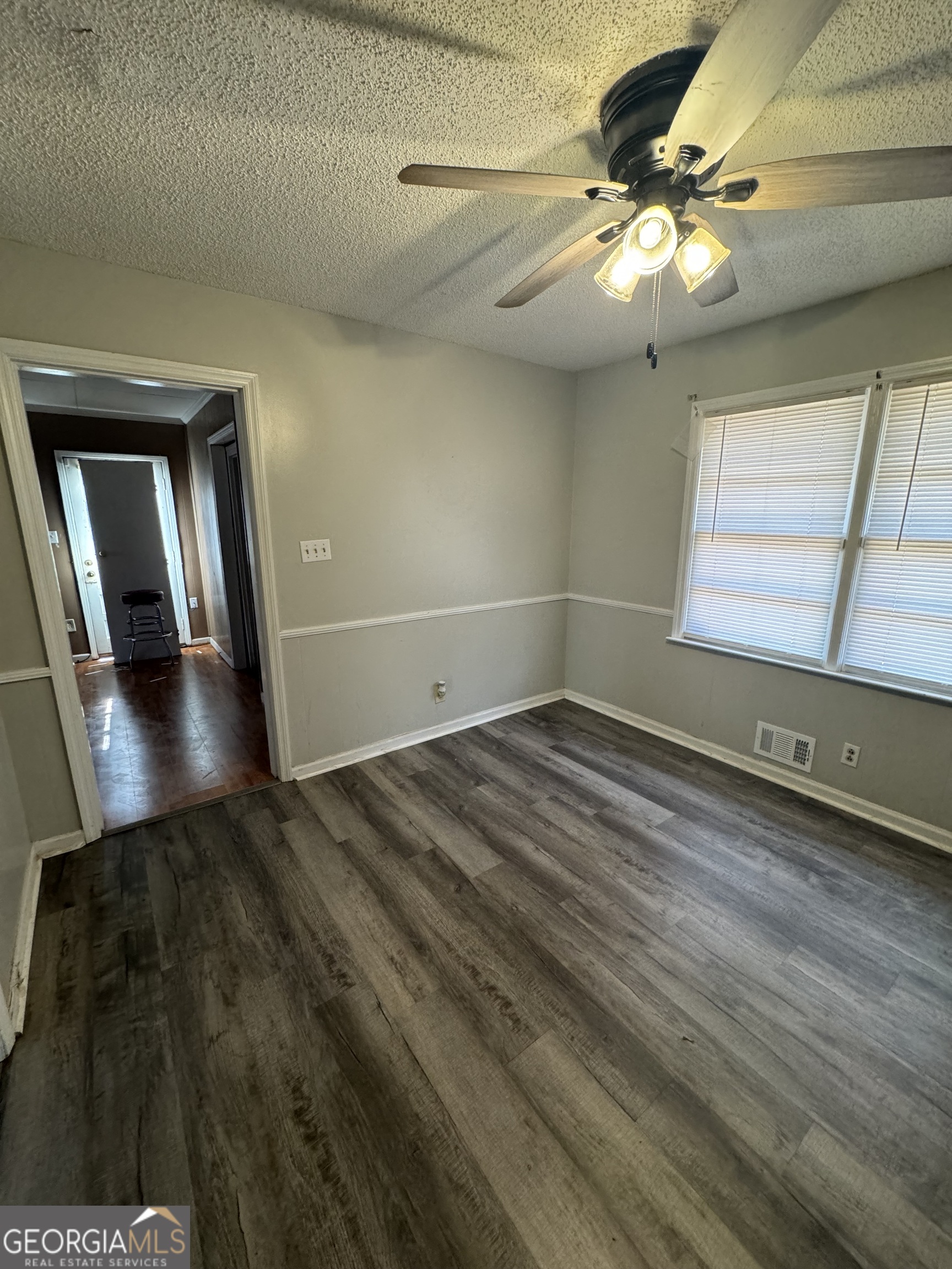 4367 Pharr Avenue Macon, GA 31210 - Photo 5 of 12 wooden floor in an empty room with a window