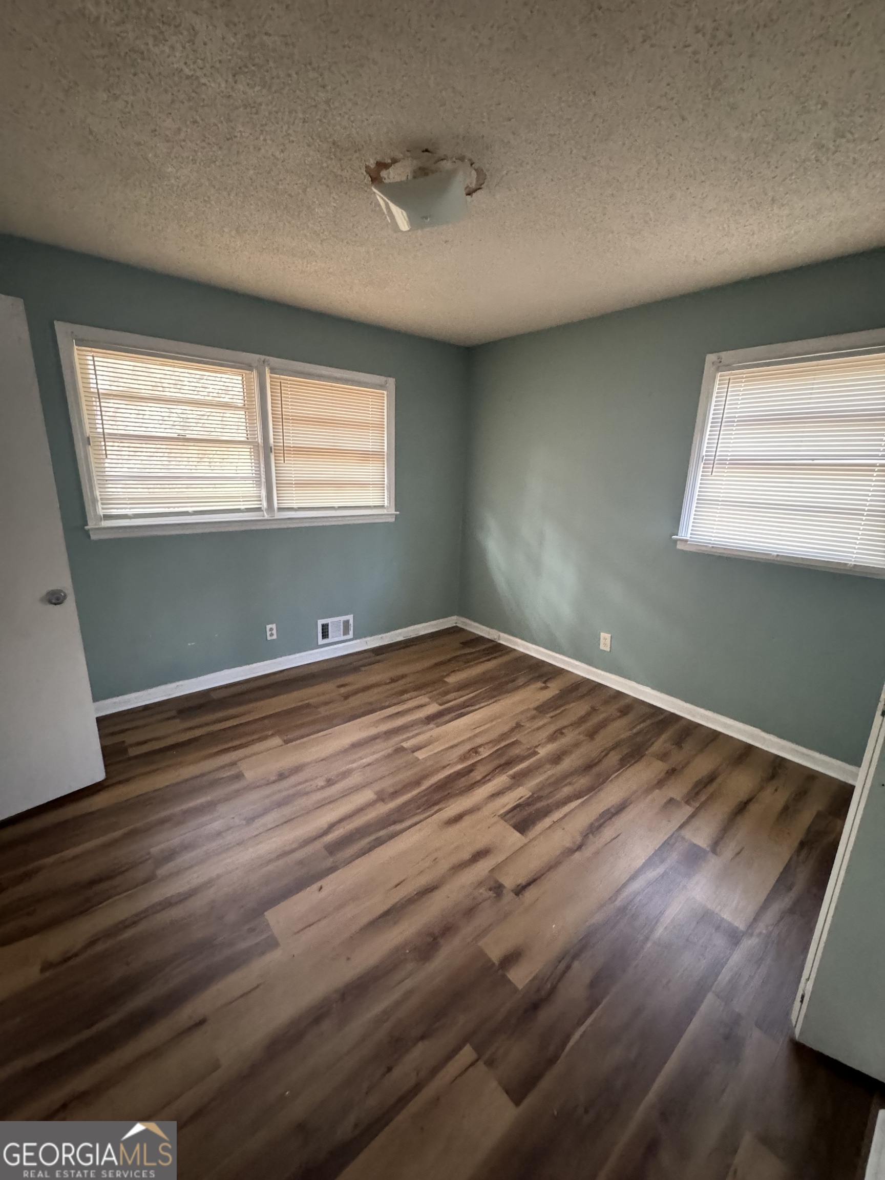 4367 Pharr Avenue Macon, GA 31210 - Photo 10 of 12 a view of room with window and wooden floor