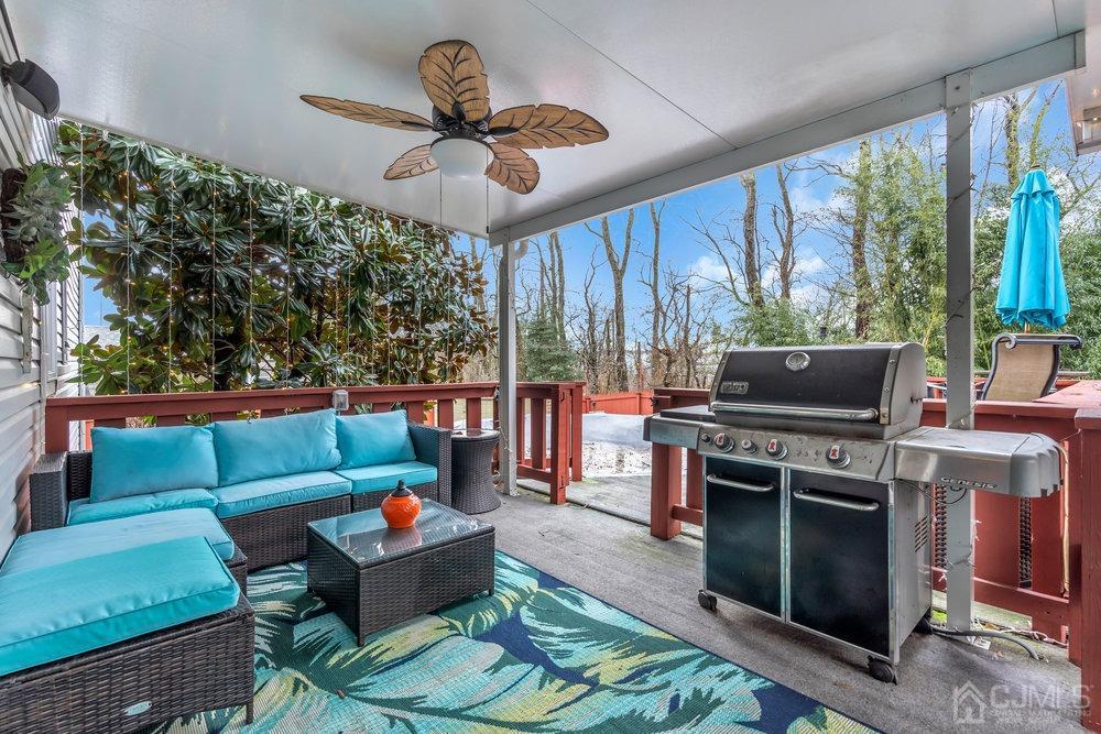 28 Ridgeview Road Jamesburg, NJ 08831 - Photo 34 of 46 It feels like you are inside, but you are really outside! View of deck underneath the permanent awning