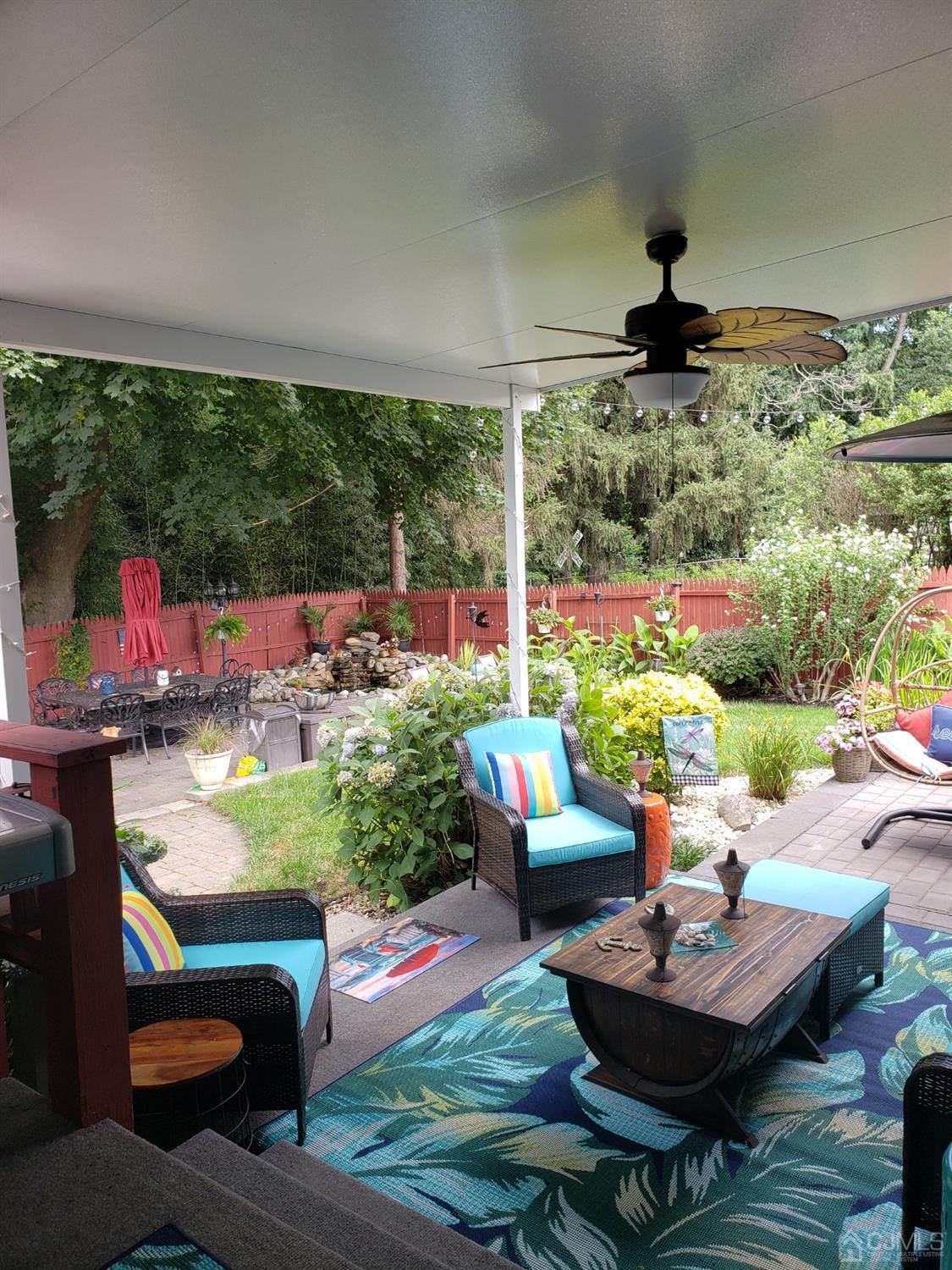 28 Ridgeview Road Jamesburg, NJ 08831 - Photo 38 of 46 Summer 2023 shot of the backyard in full bloom and furniture on display. Stunning!