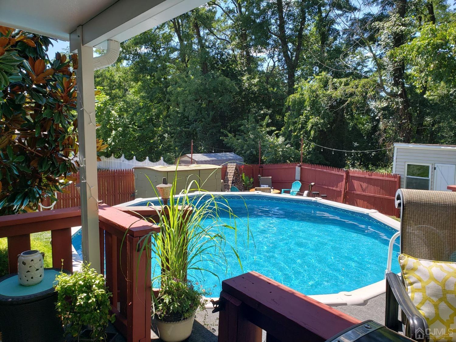 28 Ridgeview Road Jamesburg, NJ 08831 - Photo 39 of 46 Taken in summer 2023 - beautiful picture of the pool from the deck
