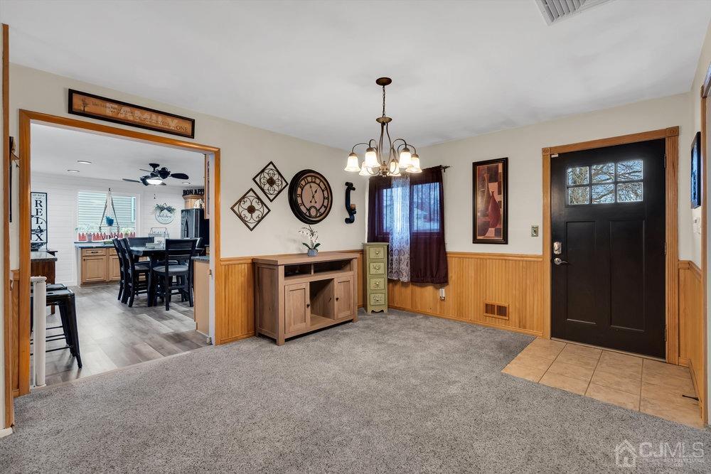 Main Entrance - foyer and dininig area with Kitchen visible