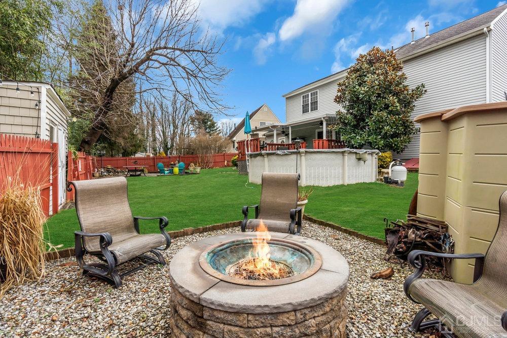 28 Ridgeview Road Jamesburg, NJ 08831 - Photo 44 of 46 View of firepit with Pool and rest of yard in the background