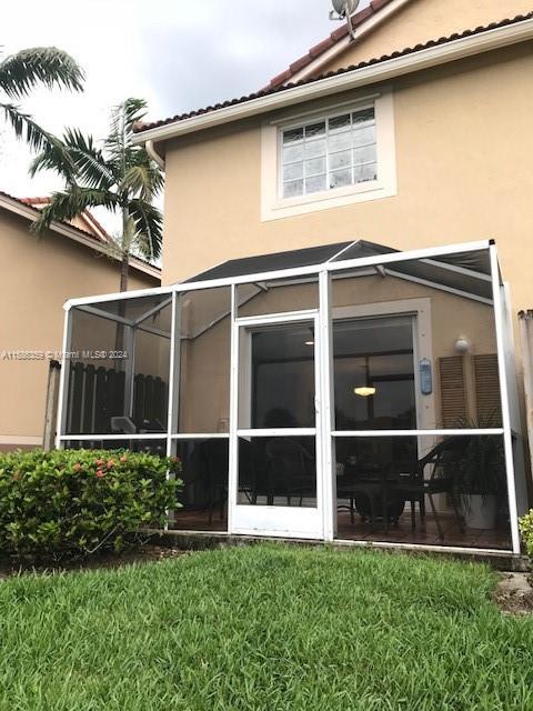 The Ridges Weston, FL 33331 - Photo 13 of 19 a view of backyard with large windows and plants