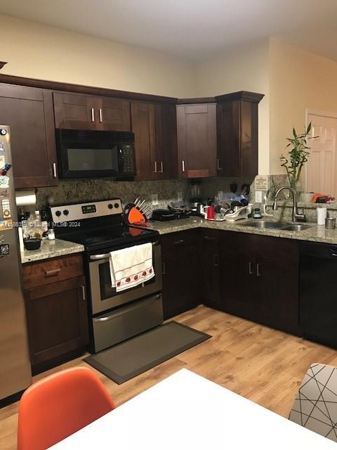 The Ridges Weston, FL 33331 - Photo 15 of 19 a kitchen with a stove a sink and a microwave