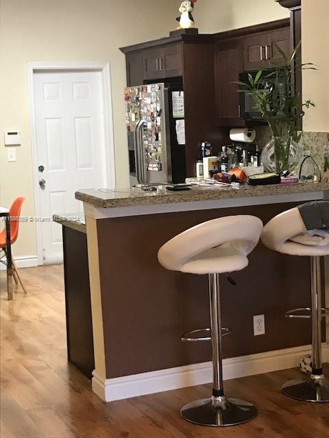 The Ridges Weston, FL 33331 - Photo 17 of 19 a dining room with table chairs and a wooden floor