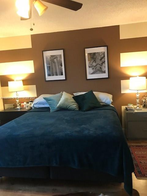 The Ridges Weston, FL 33331 - Photo 19 of 19 a bedroom with a bed and painting on the wall