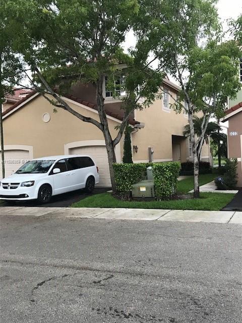 The Ridges Weston, FL 33331 - Photo 2 of 19 a view of a cars parked in front of a house