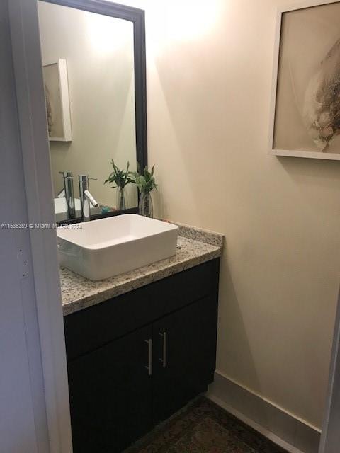 The Ridges Weston, FL 33331 - Photo 5 of 19 a bathroom with a granite countertop sink and a mirror