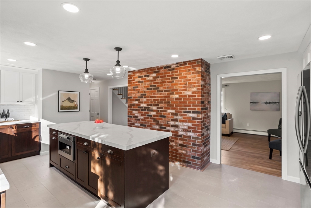 18 Higley Road Ashland, MA 01721 - Photo 17 of 42 a bathroom with a sink a vanity and a large mirror