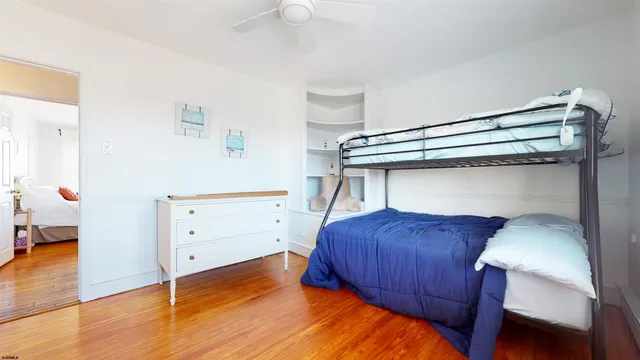 a bedroom with a bunk bed and a dresser