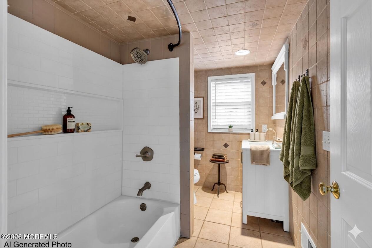 1001 Arnold Avenue Point Pleasant, NJ 08742 - Photo 11 of 14 a bathroom with a tub and a shower