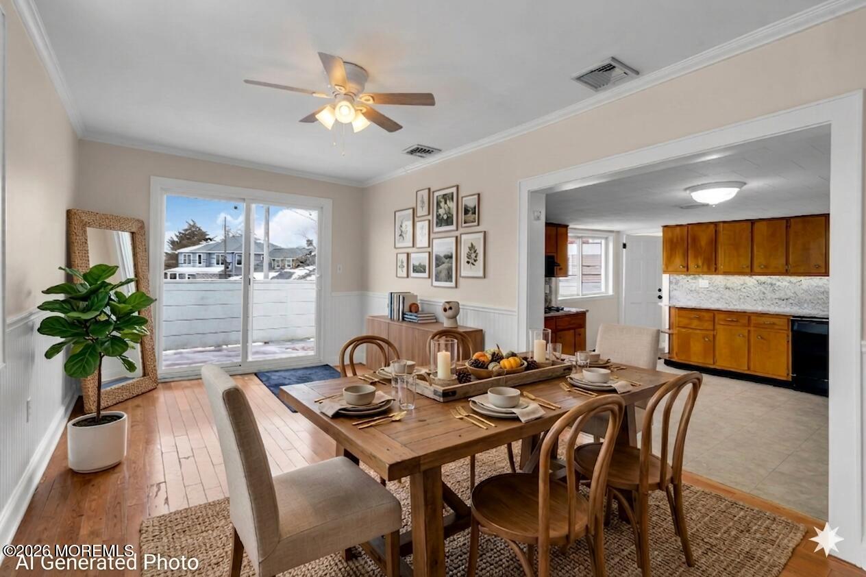 1001 Arnold Avenue Point Pleasant, NJ 08742 - Photo 3 of 14 a view of a dining room and livingroom with furniture wooden floor a rug and a chandelier