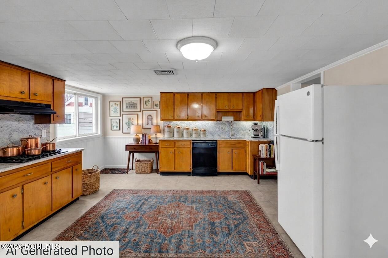 1001 Arnold Avenue Point Pleasant, NJ 08742 - Photo 5 of 14 a kitchen with stainless steel appliances granite countertop a refrigerator a sink dishwasher and a fireplace with wooden floor
