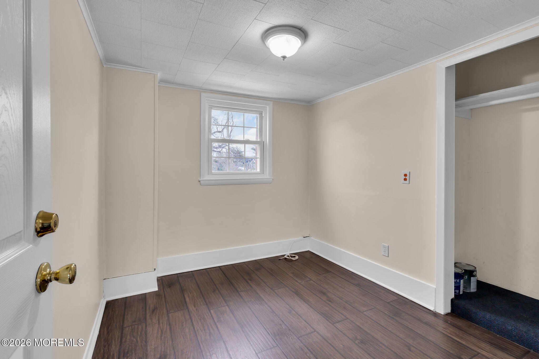 1001 Arnold Avenue Point Pleasant, NJ 08742 - Photo 10 of 14 an empty room with wooden floor and a window