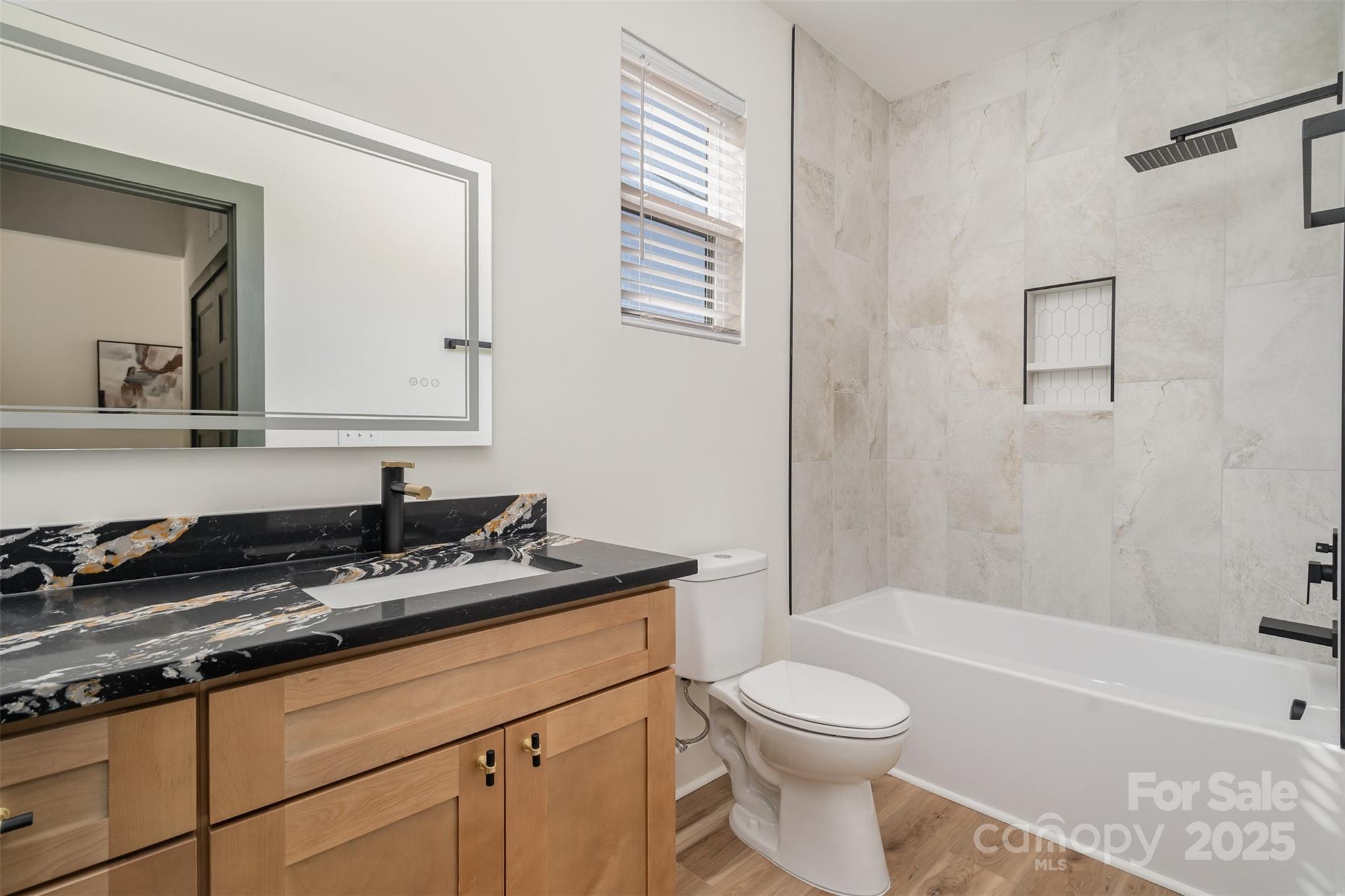 223 Robin Circle Salisbury, NC 28144 - Photo 17 of 19 a bathroom with a granite countertop sink toilet a mirror and bathtub