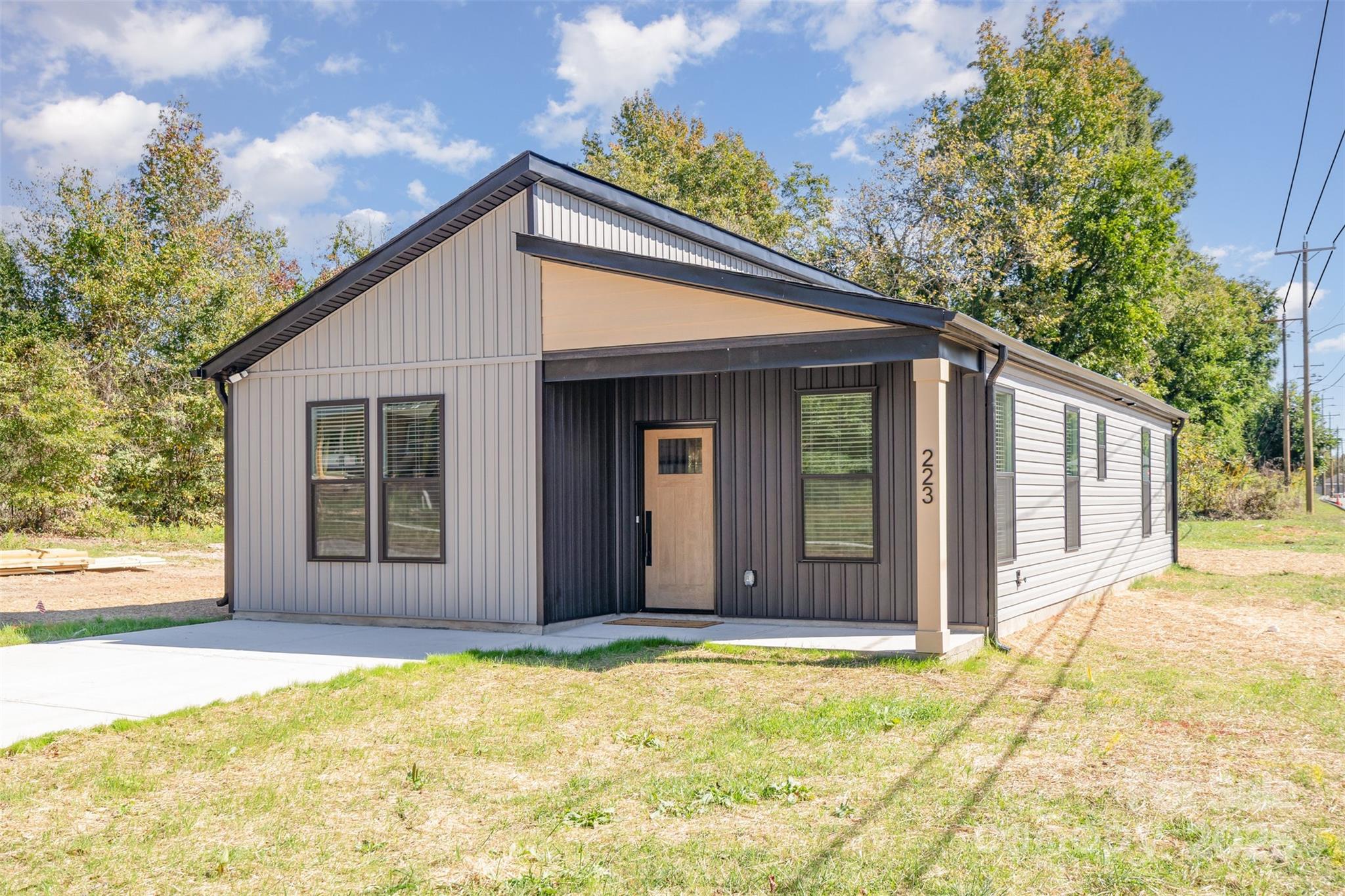 223 Robin Circle Salisbury, NC 28144 - Photo 2 of 19 a view of a house with wooden fence and large windows
