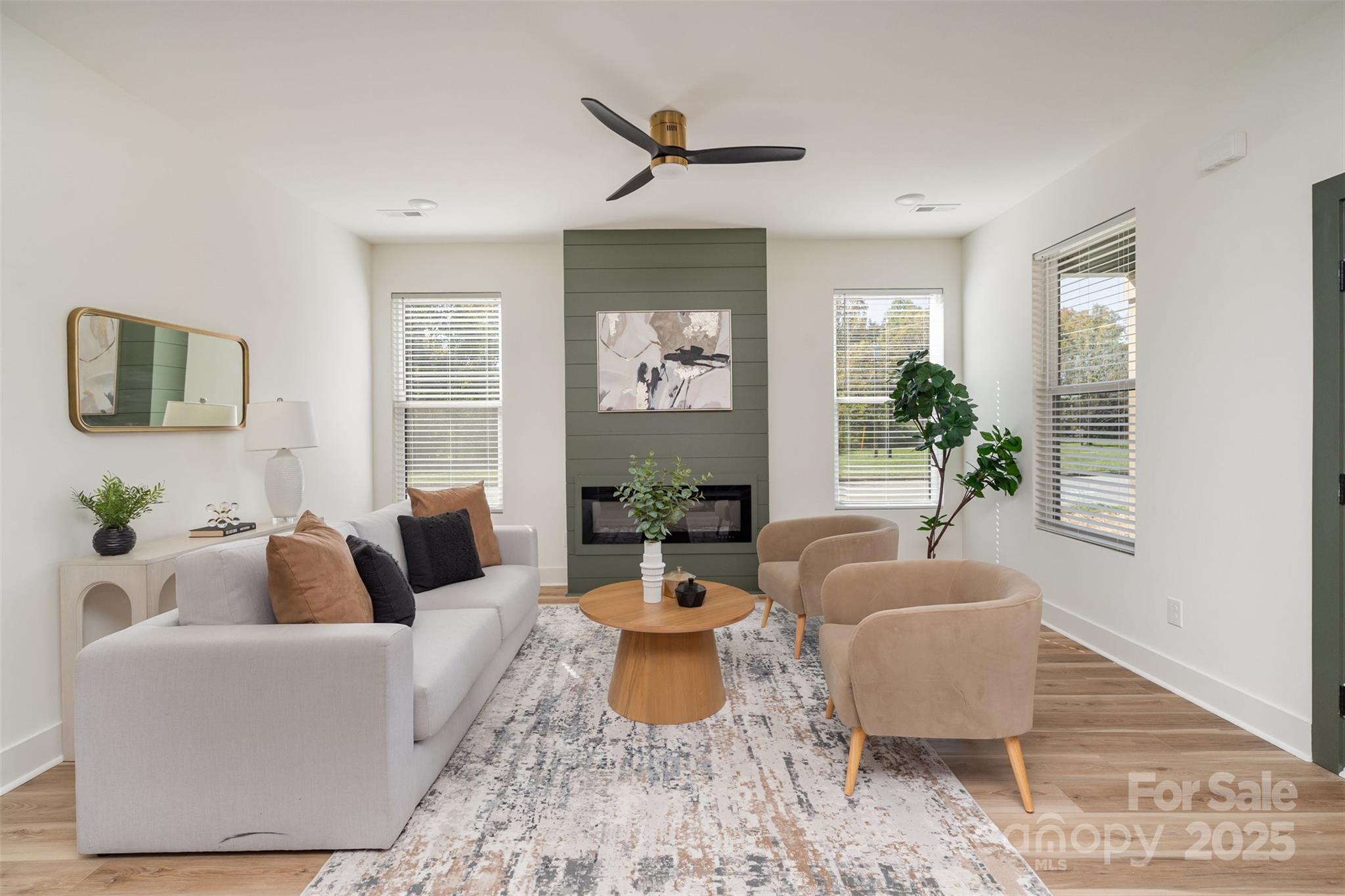 223 Robin Circle Salisbury, NC 28144 - Photo 3 of 19 a living room with furniture a chandelier and a potted plant