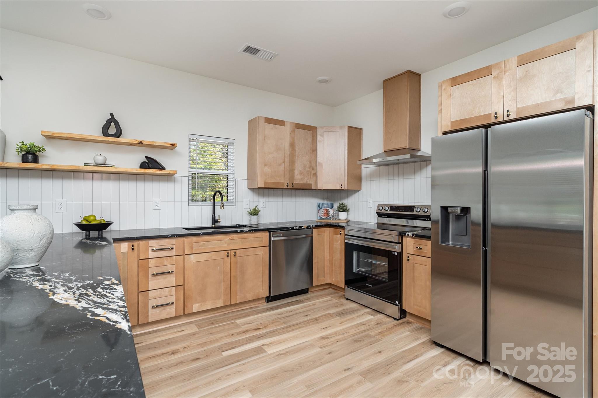 223 Robin Circle Salisbury, NC 28144 - Photo 10 of 19 a kitchen with stainless steel appliances granite countertop a refrigerator sink and stove