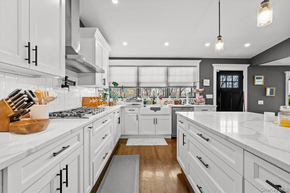 85 Joline Road Port Jefferson Station, NY 11776 - Photo 13 of 30 a kitchen with stainless steel appliances sink stove and cabinets