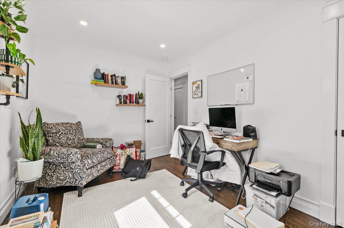 85 Joline Road Port Jefferson Station, NY 11776 - Photo 15 of 30 a workspace with furniture and a wooden floor