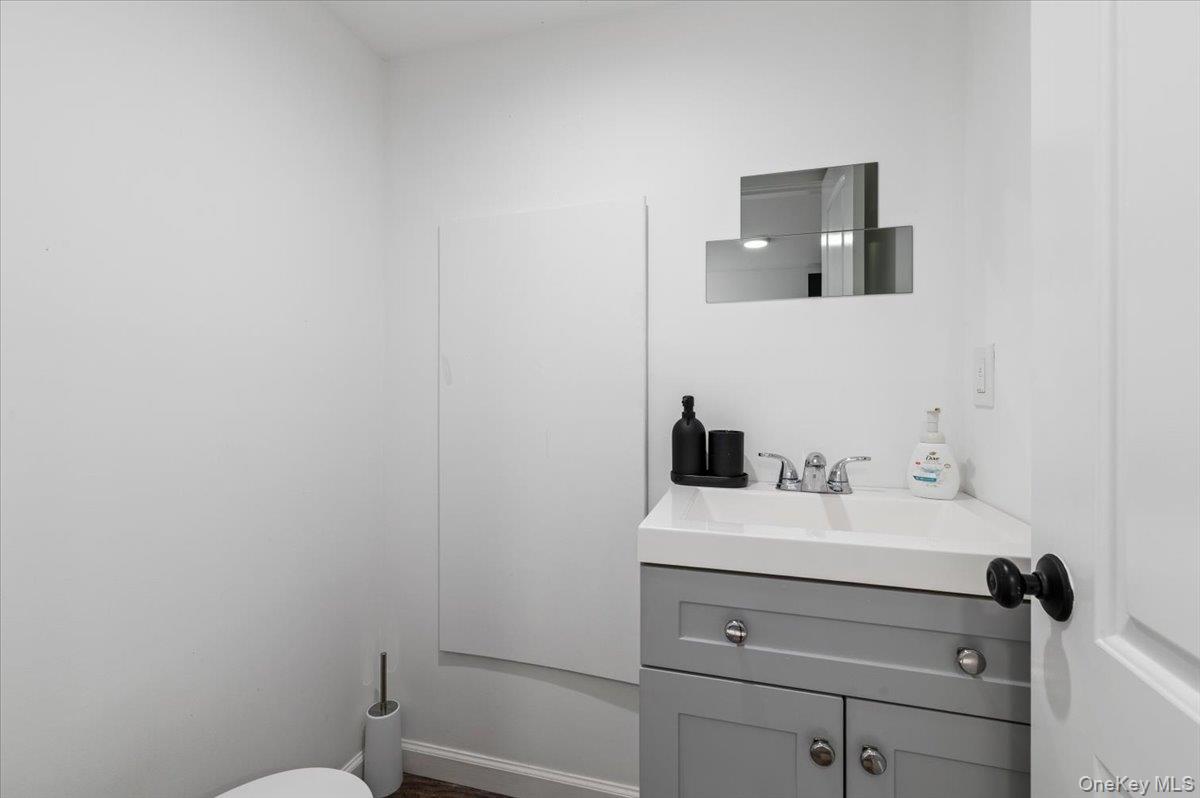 85 Joline Road Port Jefferson Station, NY 11776 - Photo 21 of 30 a bathroom with a sink and a toilet