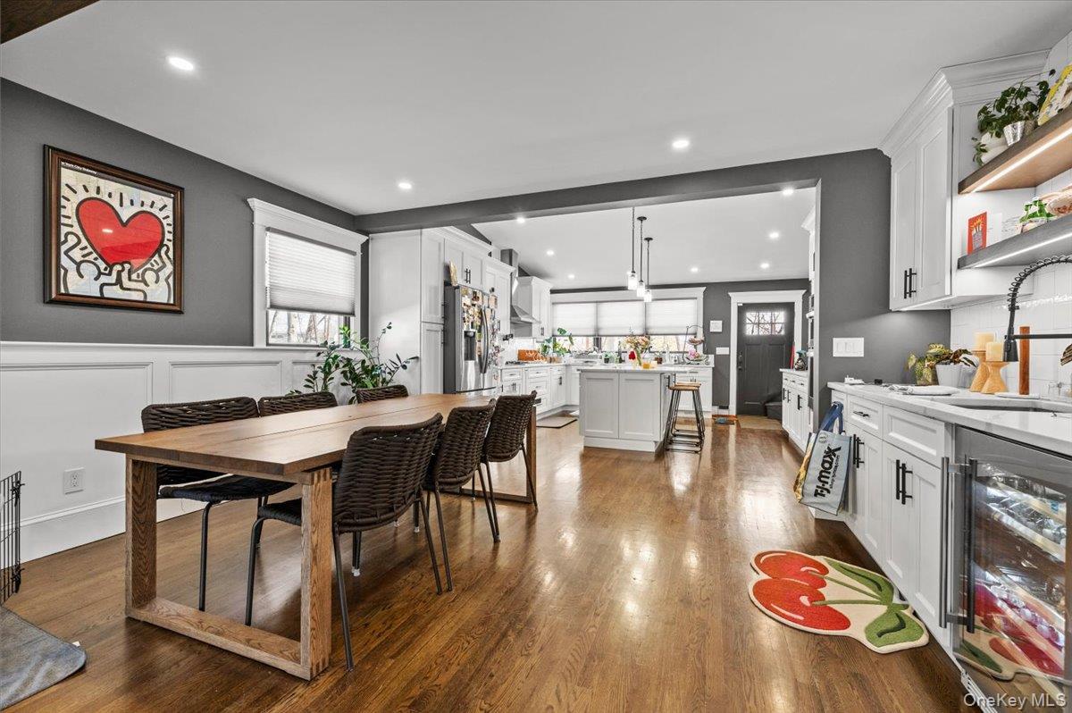 85 Joline Road Port Jefferson Station, NY 11776 - Photo 7 of 30 a room with stainless steel appliances kitchen island granite countertop a dining table chairs and view of living room