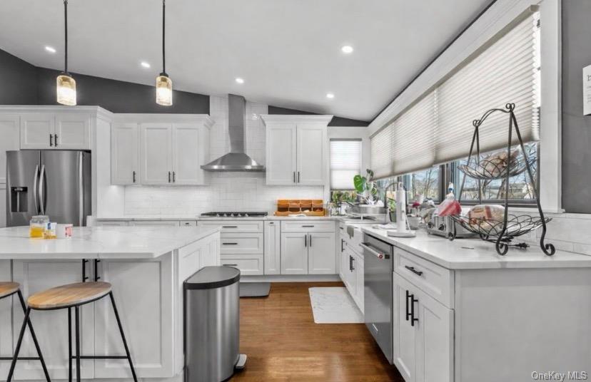 85 Joline Road Port Jefferson Station, NY 11776 - Photo 8 of 30 a kitchen with white cabinets and appliances