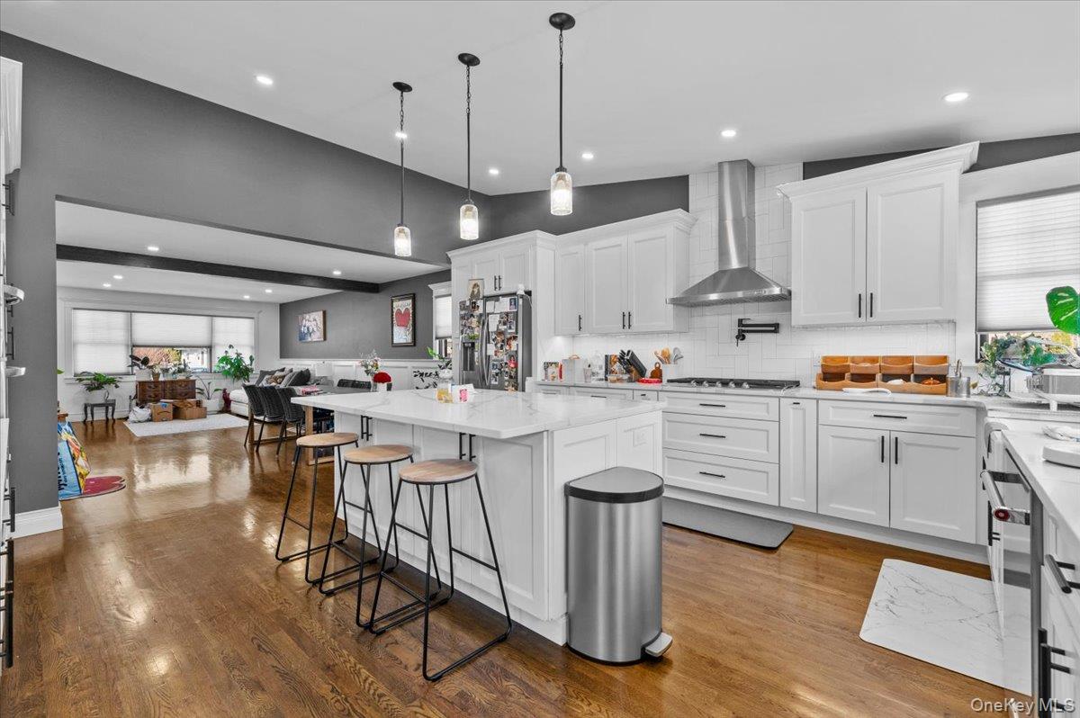 85 Joline Road Port Jefferson Station, NY 11776 - Photo 9 of 30 a kitchen with counter space appliances and wooden floor