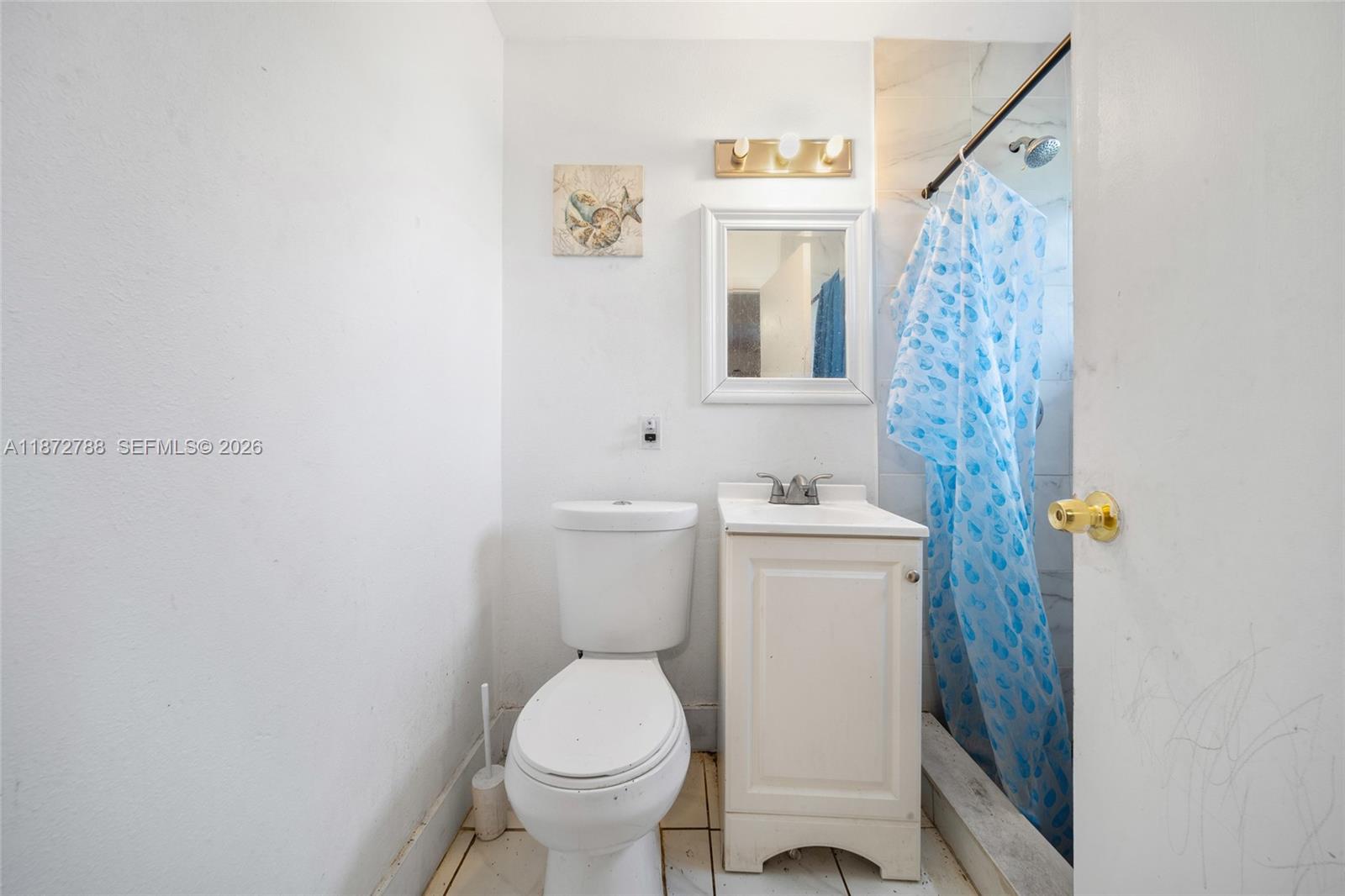 10440 Southwest 178th Street Miami, FL 33157 - Photo 12 of 30 a white toilet sitting next to a bathroom sink