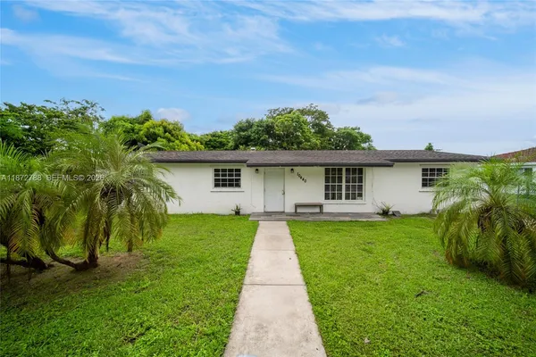front view of a house with a yard