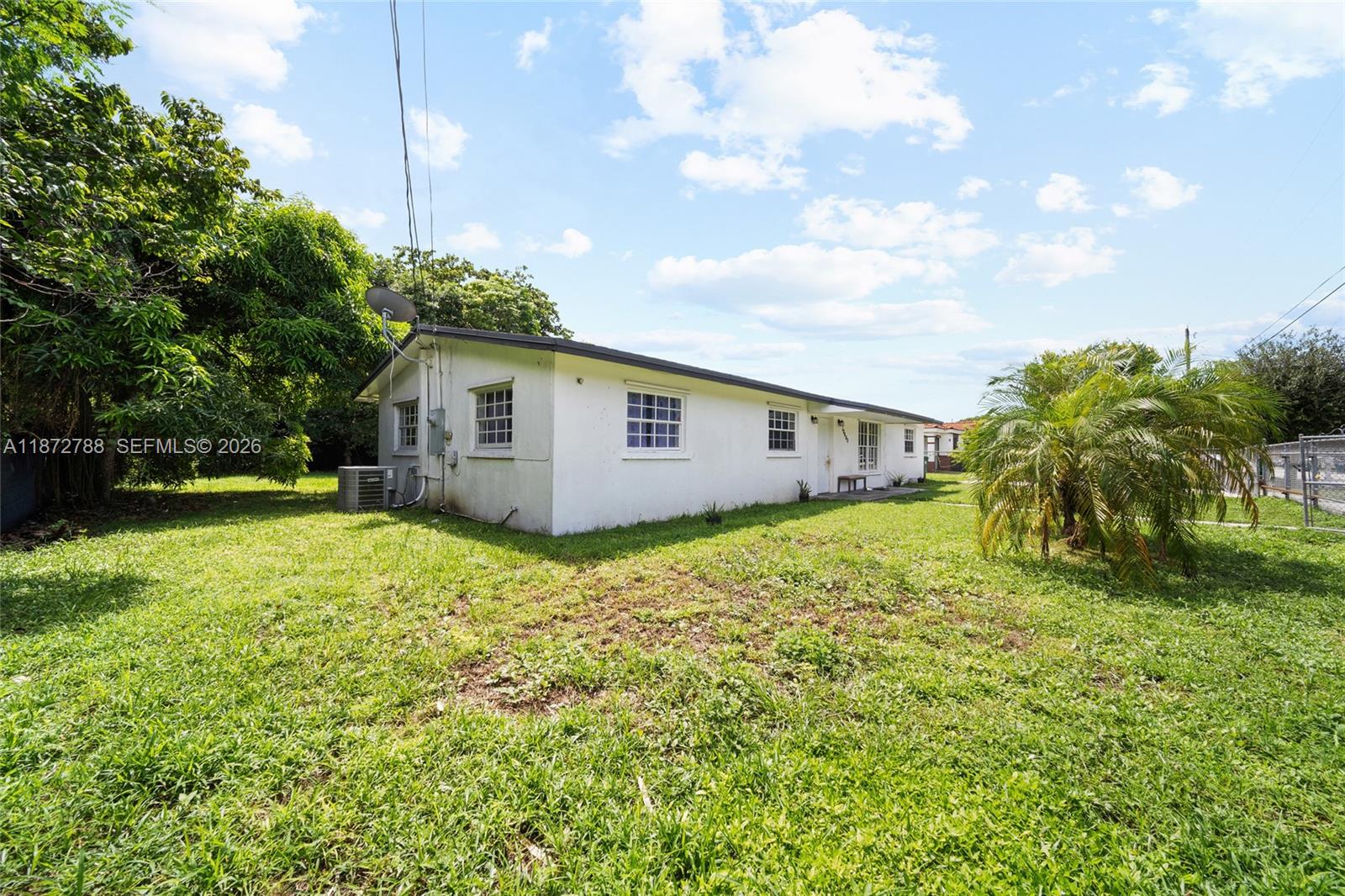 10440 Southwest 178th Street Miami, FL 33157 - Photo 23 of 30 a house view with a garden space