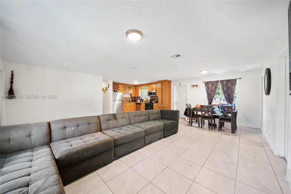 a living room with furniture and white walls