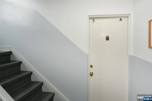 a view of entryway with wooden floor