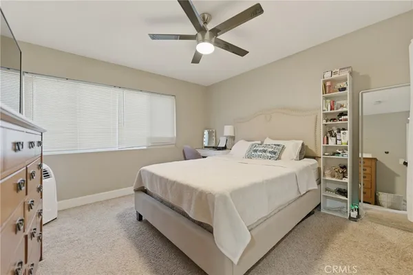 a bed room with a bed and a window