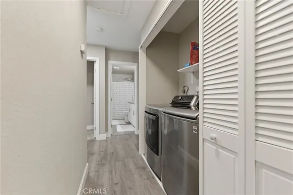 a kitchen with a refrigerator and a stove