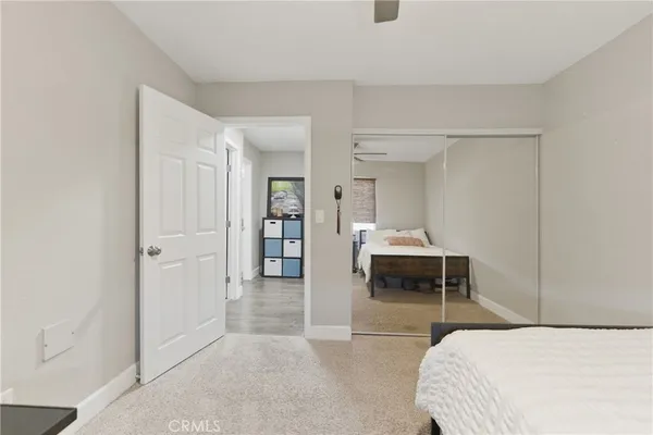 a bedroom with a bed and a chair